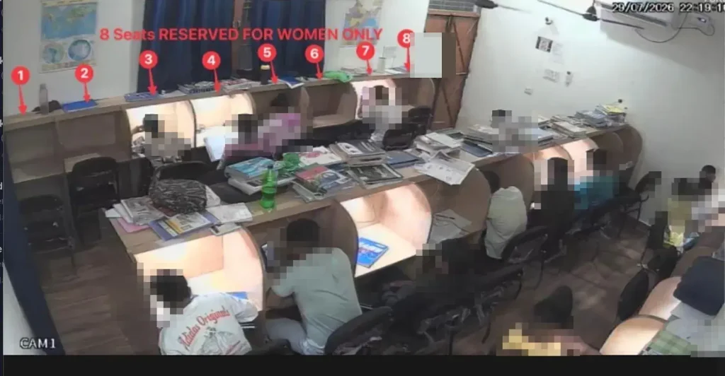 Upper-floor study pods with eight seats marked reserved for women, faces blurred for privacy